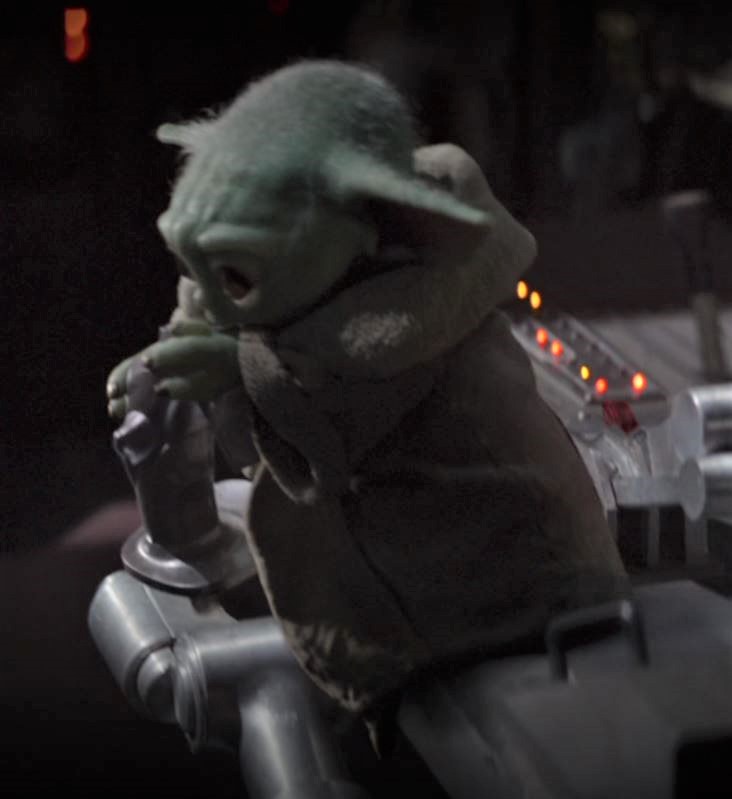 The meme is a screenshot of the character Baby Yoda from the TV show "The Mandalorian" sitting in a high chair, looking unimpressed and disinterested. The text "When you're trying to learn to fly but you're still working on walking" is overlaid on the image, implying that Baby Yoda is frustrated with his own lack of progress. The meme is a humorous take on the challenges of learning new skills.